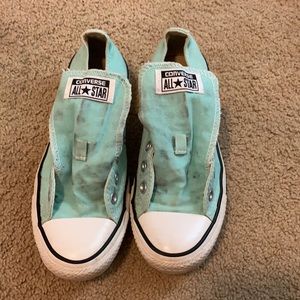 One pair of teal converse